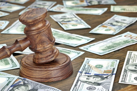 Financial Crime or Auction Concept With Gavel And Money Backgrou