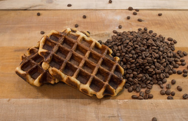 Two fresh waffles with coffee beans