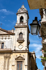 Fototapeta na wymiar Old church and weathered buildings in Old Havana