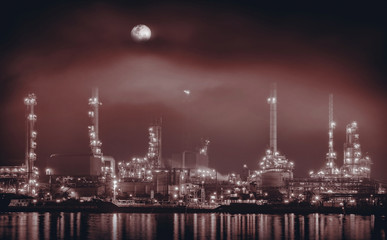 Naklejka premium Oil refinery / Oil refinery reflex on river, digital retouch. Brown tone.