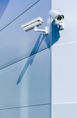 Surveillance camera on wall