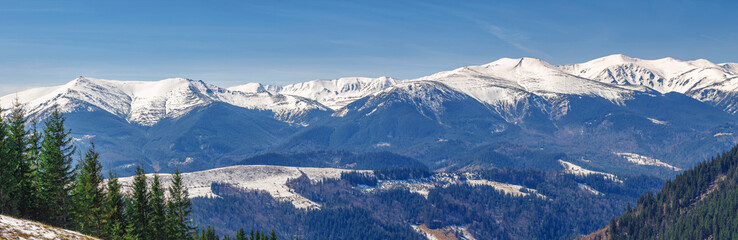 Naklejka premium landscape, spring snow-capped mountain range