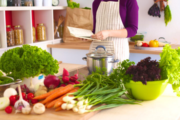 Young Woman Cooking in the kitchen. Healthy Food