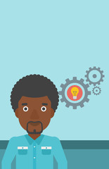 Man with business idea bulb in gear.