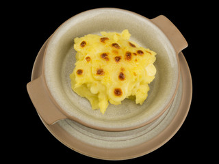 Mashed potatoes with cheese isolated on the black background with clipping path