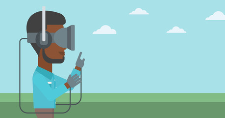 Man in virtual reality headset playing video game.