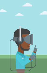 Man in virtual reality headset playing video game.