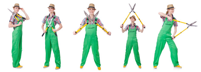 Young woman with shears on white