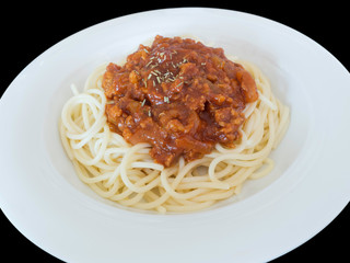 Spaghetti bolognese on a plate  isolated on the black background