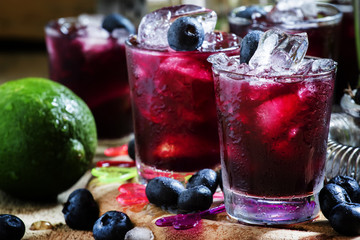Alcoholic cocktail Darkside, with liqueur, blueberry, lime juice