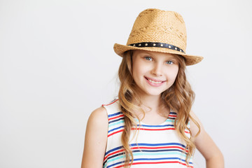 lovely little girl with straw hat on white background