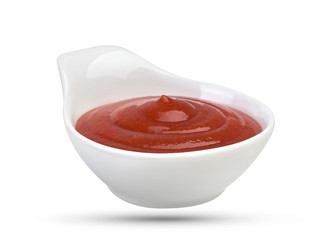 Bowl of tomato ketchup isolated on white background