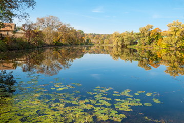 Autumn Landscape with a lake and a forest on the banks