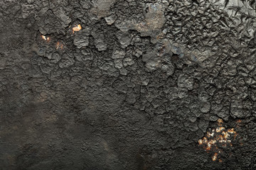 Black old metal background. The surface of the pan. Toned