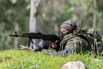men in military uniform with weapon