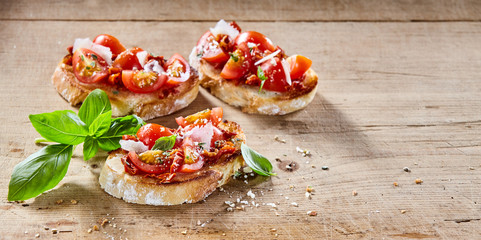 Tomato Italian bruschetta on toasted baguette - obrazy, fototapety, plakaty
