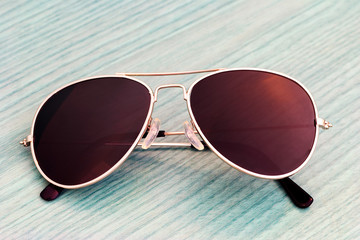 Yellow glasses on wooden boards