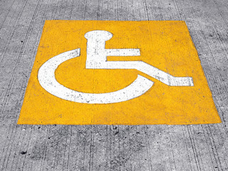 handicap parking sign paint on floor, space reserved for disabled person