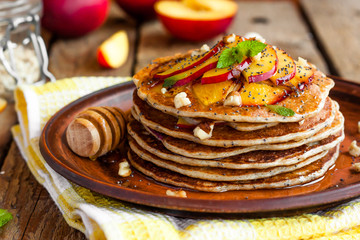 Pancake with poppy seeds and peaches