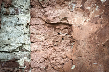 Old brick with concrete crack. Grunge background