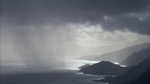 Turneresque Sunlit Valley Through Rain Clouds