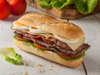 Chivito, a typical sandwich from Uruguay with beef, bacon, cheese and egg.