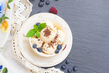 scoops of vanilla ice cream with chocolate
