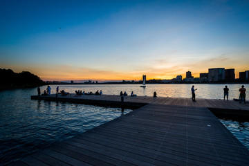 Fototapeta na wymiar Dock at sunset at the Charles River Esplanade, in Boston, Massac