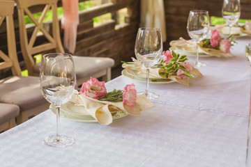 flower composition and candles in the restaurant. Wedding dinner