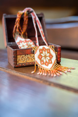 Ukrainian national ornament of beads in a box with carvings.