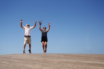 Fototapeta na wymiar senior couple jumping