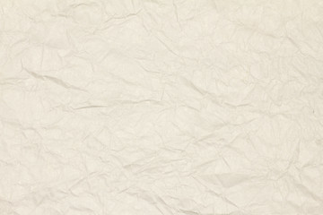 Recycled crumpled light brown paper texture or paper background for design with copy space for text or image.