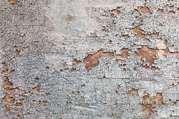 background texture from cracked sunburnt paint on wood