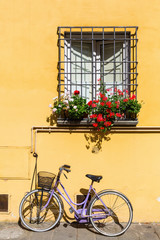 Fototapeta na wymiar window of a mediterranean house with bicycle