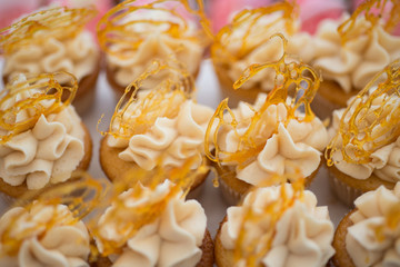 Coffee butterscotch cupcakes with spun sugar decoration