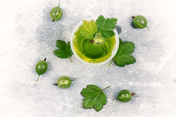 gooseberry jelly on a gray stone background top view