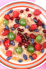 breakfast oatmeal with berries and honey on white wooden background flat style top view overhead summer menu