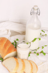 milk and bread on a white lace background bio organic product fresh pastries healthy lifestyle