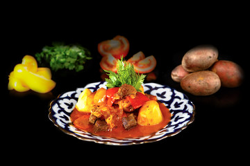 Fototapeta na wymiar Lamb stew with potatoes and vegetables