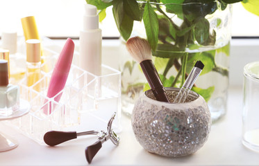 Cosmetic set on white windowsill