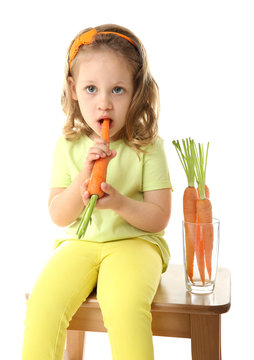 Beautiful girl with carrots, isolated on white