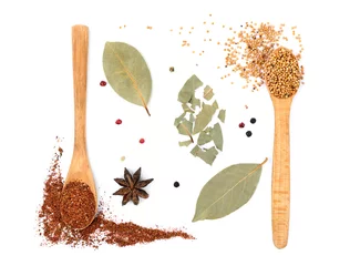 Washable wall murals Herbs 2 Composition of different spices in wooden spoons on light background
