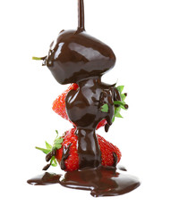 Pouring melted chocolate on juicy strawberries on white background