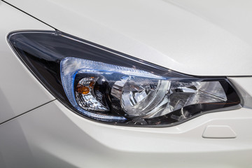 ヘッドライト　Head lamp of the blue car © norikko
