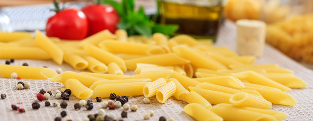 Raw penne pasta with vegetables