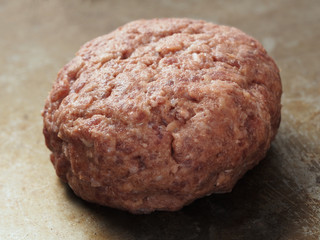rustic uncooked hamburger patty