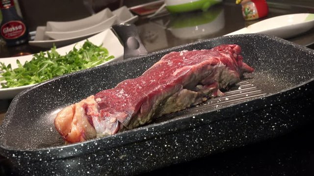 grilling a beef steak: T-bone steak, beef, Italian cuisine
