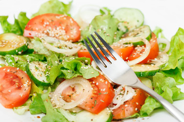Fresh green salad with sesame, oil, soy sauce and oil