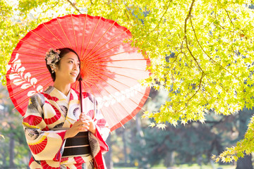 attractive asian woman wearing kimono in autumn