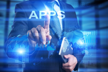 Businessman is pressing on the virtual screen and selecting Apps.